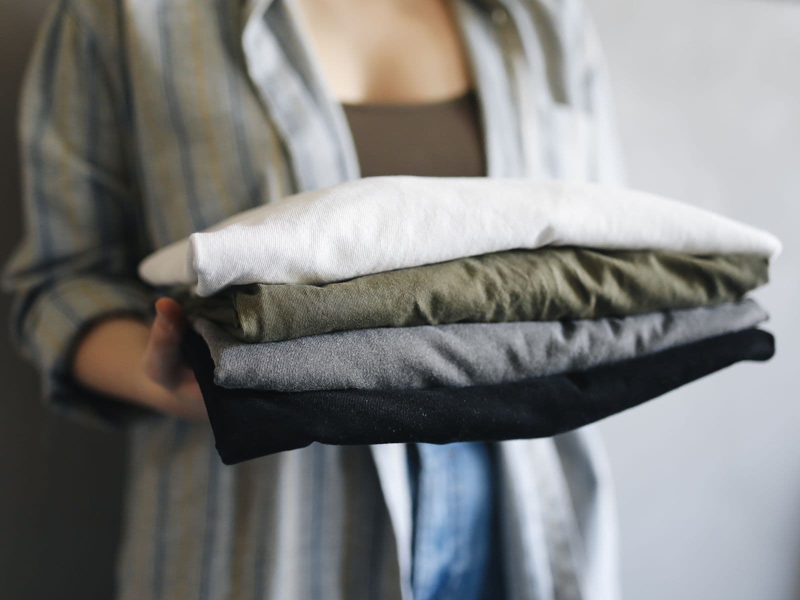 Finished folded garments checked for appearance before packing